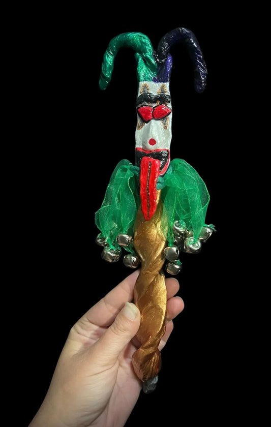 Colorful jester wand with vibrant ribbons and bells, perfect for magical rituals and performances.