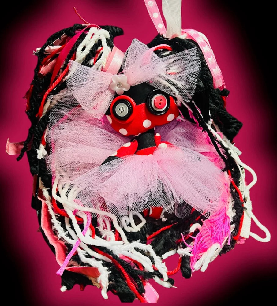 Minnie Mouse voodoo poppet with removable accessories and pink tutu. Quirky art doll perfect for collectors and witchy decor.