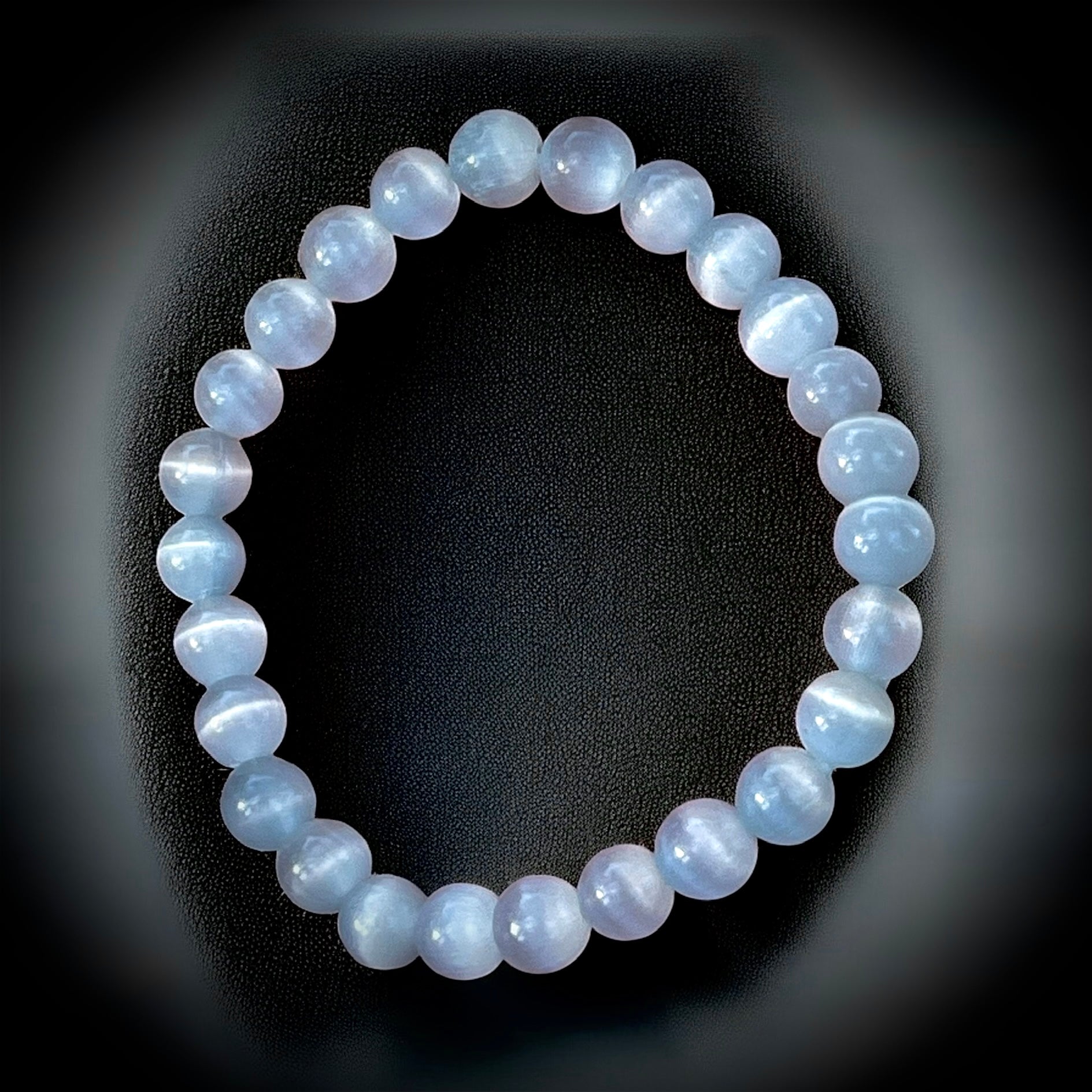 Clear white cat eye crystal bracelet for intuition, mental clarity & spiritual protection.