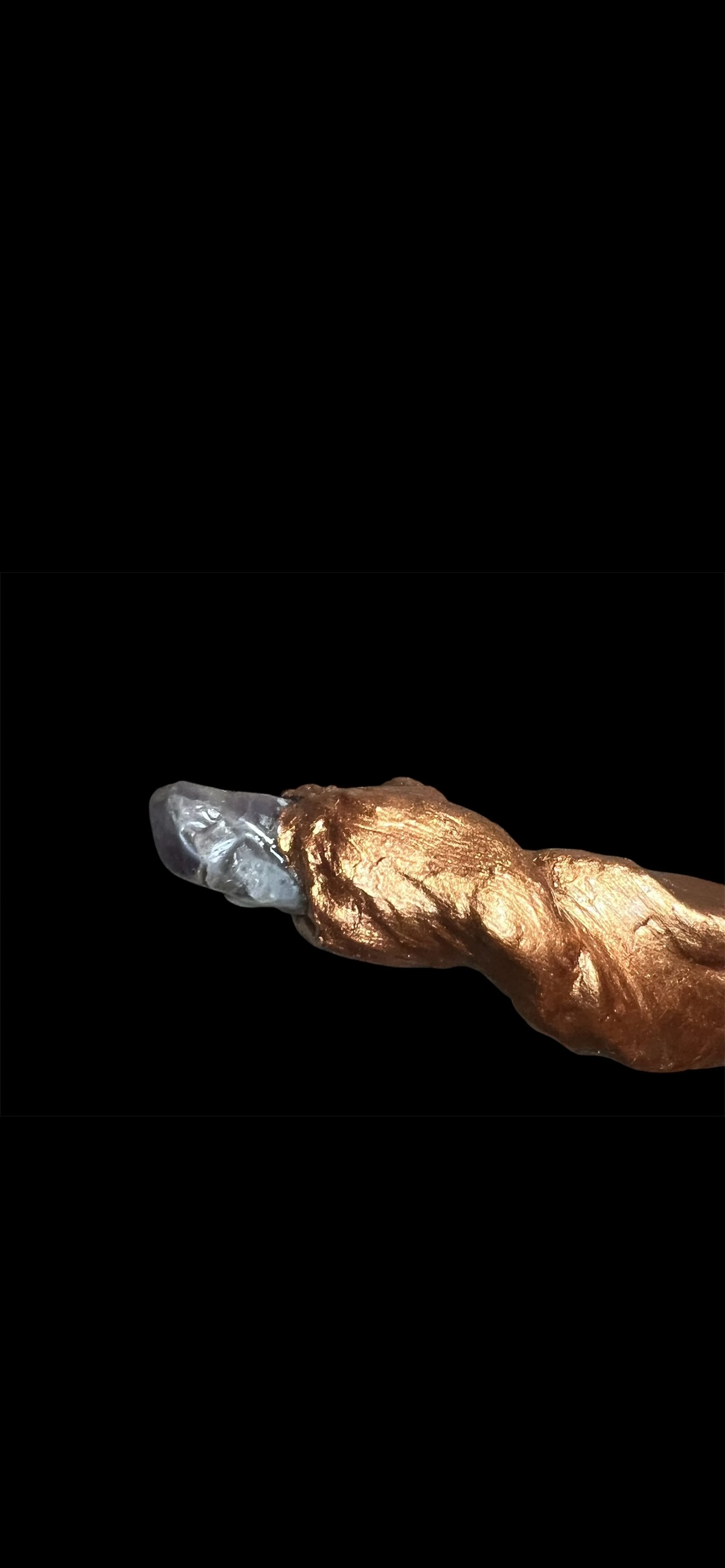 Decorative jester wand with multicolored streamers and a purple amethyst crystal