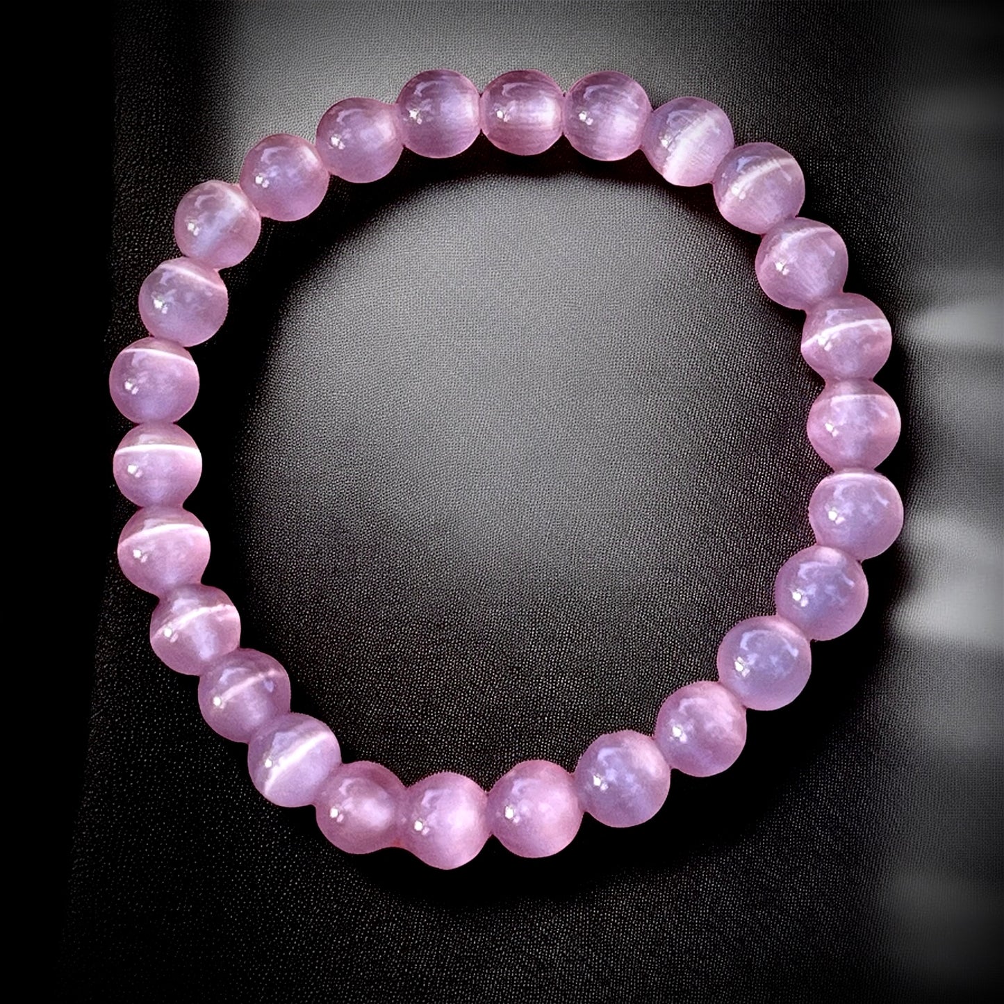 Dark pink cat eye bracelet for love energy, emotional healing & self-confidence.