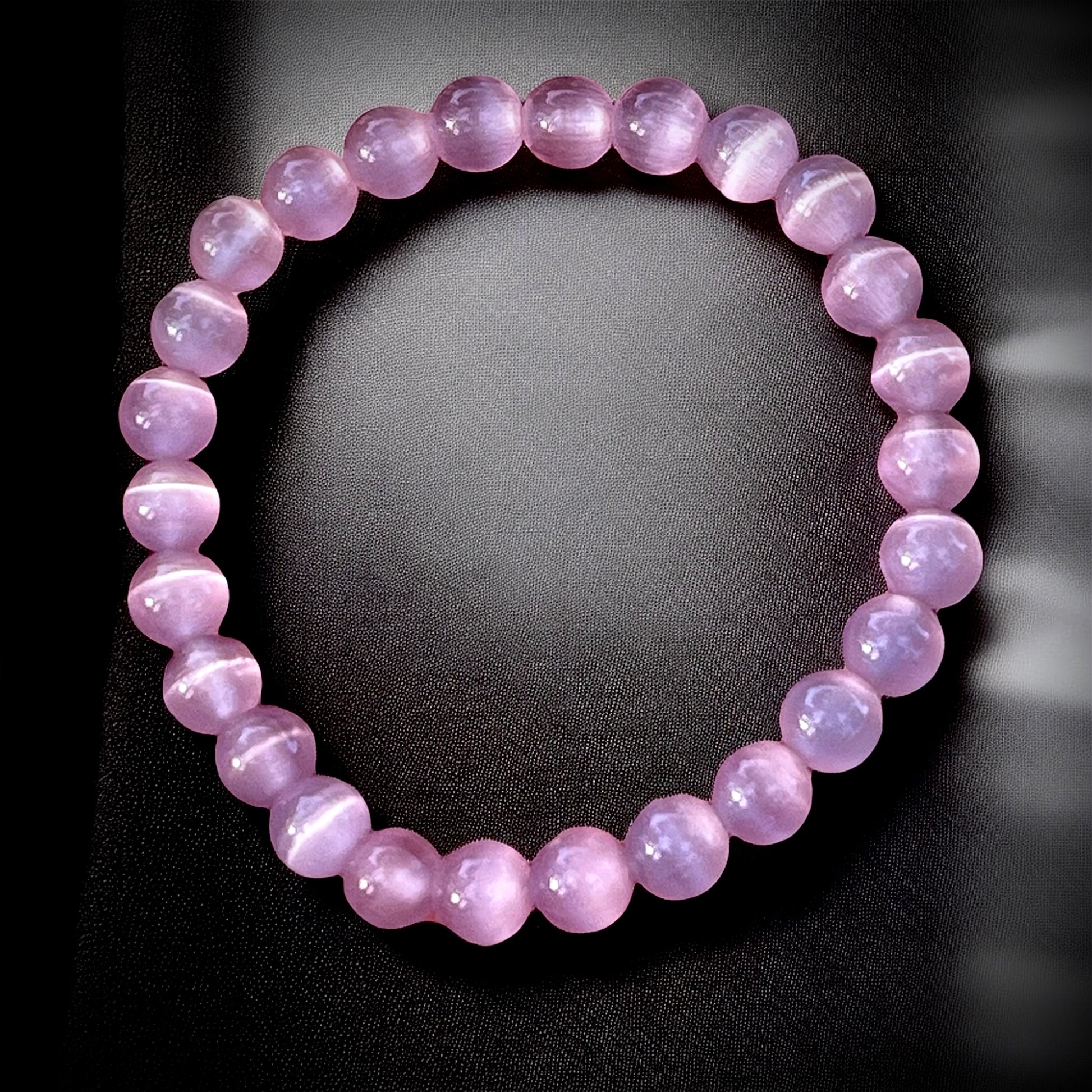Dark pink cat eye bracelet for love energy, emotional healing & self-confidence.