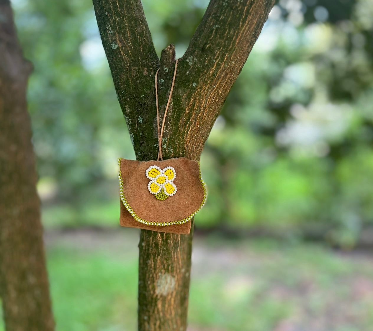 vintage medicine bag with protective spell work and adjustable neck cord.