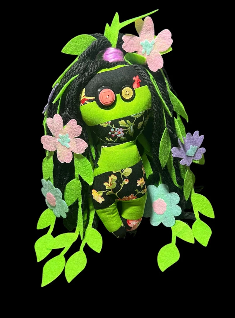 Poison Ivy poppet doll featuring detailed leaf design and mystical charm.