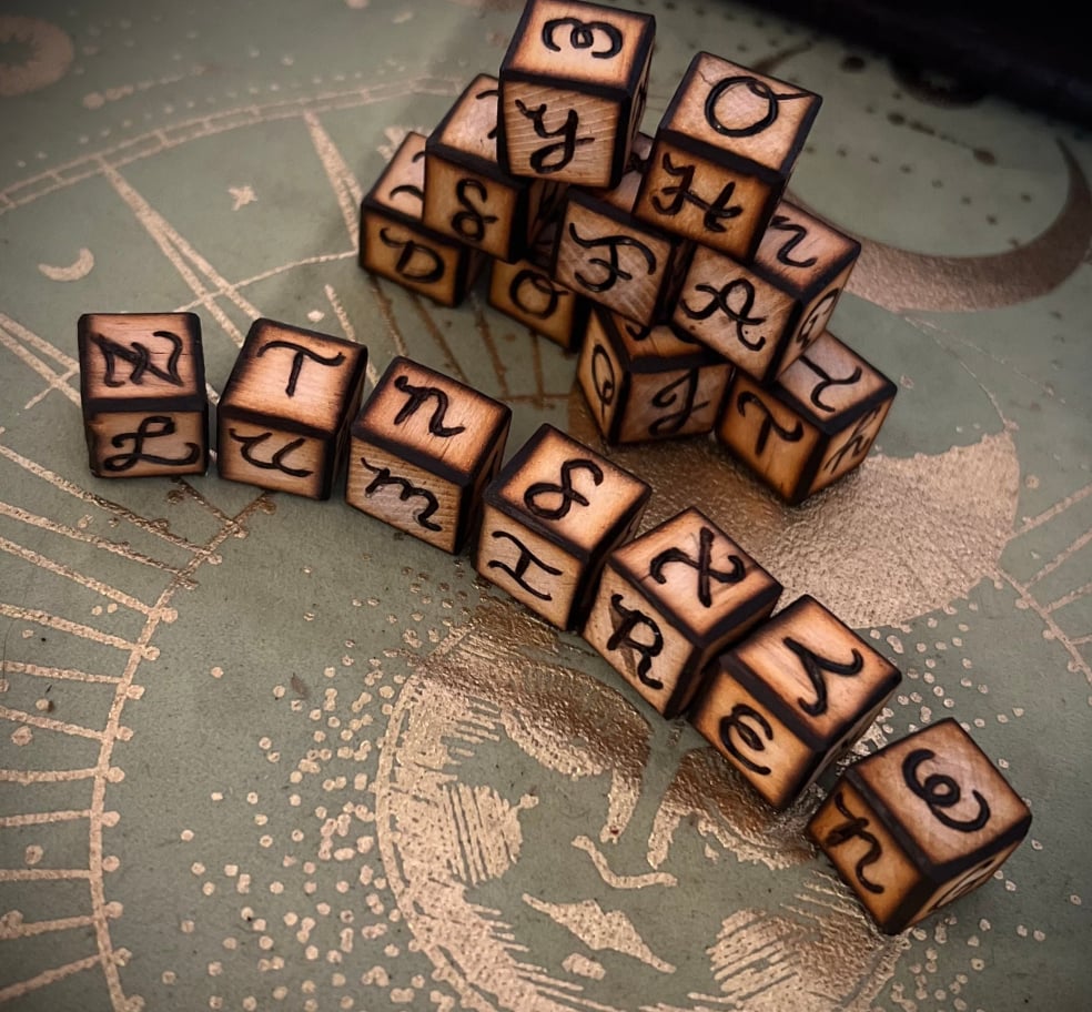 Handcrafted woodburned spirit dice for divination and spirit communication.