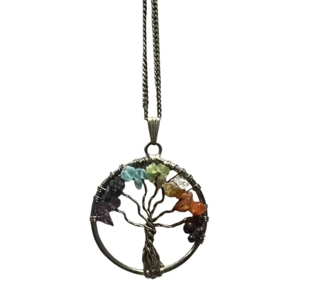 Magical Tree of Life pendant adorned with vibrant chakra stones, symbolizing grounding, spiritual harmony, and protection — a mystical talisman for balance and energy flow