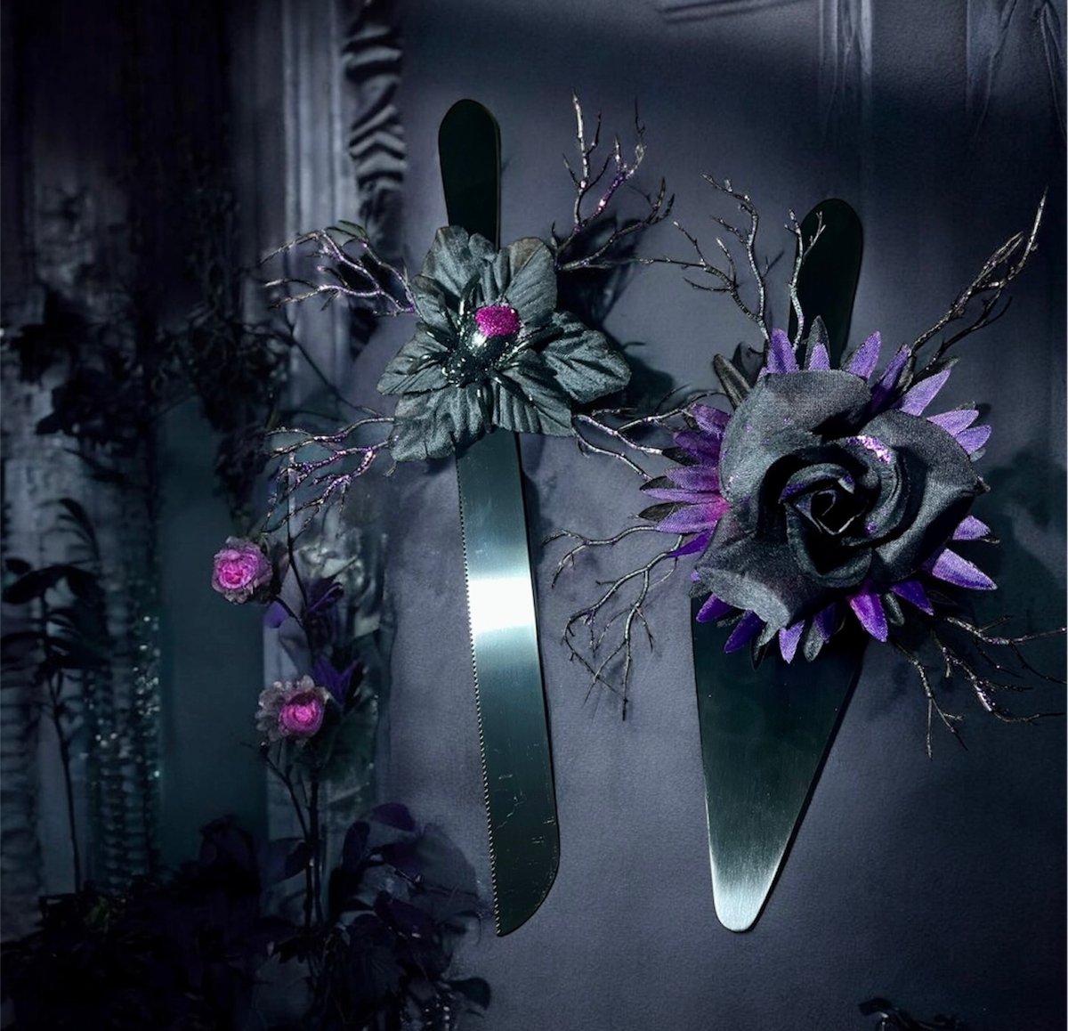 Black stainless steel cake knife and server set with removable gothic floral and spider accents. Perfect for gothic weddings